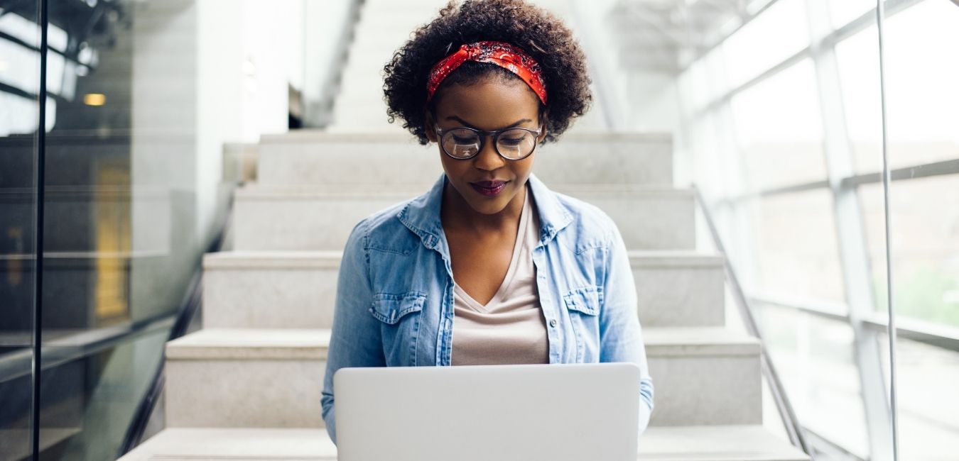 Adult woman looking at her laptop Adult woman looking at her laptop